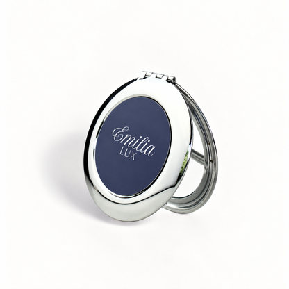 Emilia Lux silver compact mirror with navy logo