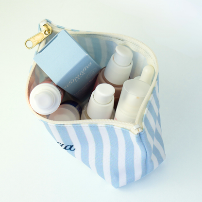 Striped travel cosmetic pouch for organizing makeup and skincare in style